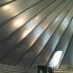 The roof is in place, but most of the hardware has yet to be installed and tightened.
