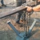 Securely fix the lifting ring to your crane, etc., or set up grain bin jacks. For a very small bin, a minimum of 4 jacks should be used. For a small to medium, 6 or more are required.