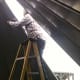 At this stage, one person can install hardware. There is a gap 2 sheets wide here. The next sheet will be fitted, and the roof ladder installed soon. The manhole sheet will be the last of the roof panels.