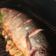Whole grilled salmon with lemon and shallots