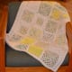 White-bordered pastel baby afghan
