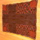 Finished autumn-colored afghan with cross pattern.