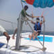 Water sports activities, paragliding on the Goan sea.