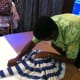 One of the staff members of Estrela Do Mar Beach Resort in Goa preparing a duck made from cotton towel.