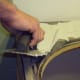 Use a trowel to apply a thin layer of mortar to countertop.