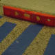 Use a level to make sure surface remains level. Use painter's tape to keep tile pieces in place.