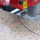 This tile saw has a nifty laser guide for cutting.