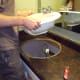 Carefully lift the sink out and away from the countertop.