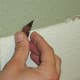 Use a razor (be careful!) to scrape off remaining adhesive.