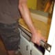Old countertop is placed back on the cabinets.