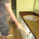 Use a rubber mallet to loosen a stubborn countertop.