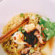 The chicken broth is a star of the dish. Usually, I will use a whole chicken that I cut into a small pieces and throw in the pot and cook for a while.