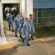 Traditional exit from the crew quarters to the "AstroVan" for the 11-mile trip to the launch pad.