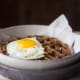 Leftover stuffing waffles with a perfect runny-yolk egg