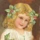 Little girl with Christmas holly