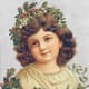 Little girl with Christmas holly crown and wrap