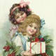 Little girls with holly and presents