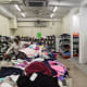 Inside the shop with carts of cheap clothes