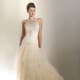 Crepe and silk fabric, soft tulle ruffles, hipster dropped waistline, halter neckline.