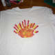 Repeat procedure using yellow paint making 2 handprints this time. Wash hands and let paint dry.