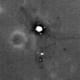 Enlargement of previous photo showing tracks. Sun is directly behind LRO, so sun-glare off flat metal surface of lander legs & platform shows as white.