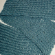 A figure eight scarf in blue, done with only one yarn, yields a light-weight and airy feel.