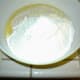 Add the milk mixture and beat until smooth. That wooden spoon is handy for this.