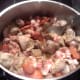 Adding the "chouriço" and bacon