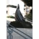 Il Cardinale Seduto, a bronze sculpture on the steps in front of the church.