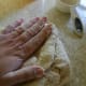Place the dough ball on the counter. Press the dough out with your hand.