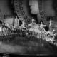 Gold Diggers of 1933 in the musical number "Dance of the Dollars." The dancers are holding large coins and doing a "wave."