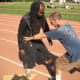 Here, Jamie strikes at Glenn's hip joints which bends Glenn at the waist, manipulating his height and depth zone and could, if enough force is used, put Glenn on the ground.