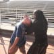 Here, Glenn uses a combination of pulling on Jamie's head and pushing (or striking) his hip joint (or striking the kidney). This turns Jamie's body so that he cannot effectively strike, canceling his height, width, and depth zones simultaneously.