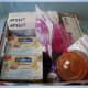 Put the largest baby gifts in the basket first, starting with the most symmetrical.