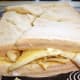 Cutting the crisp and banana sandwich into quarters
