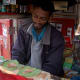 See the red door on the left. That is the entrance to this shop.