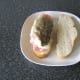 Cod fillet is placed skin side up on bacon rashers