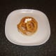 Mayo spooned on to turkey bacon and sage and garlic onion rings