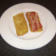 Pancetta laid on bottom half of ciabatta