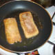 Frying ciabatta halves in bacon juices