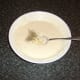 Mixing sage and garlic batter