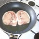 Middle bacon is put on to fry
