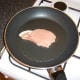 Frying the pork fillet in a little oil