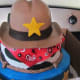 A delicious cake with a cowboy and badge made the theme even more playful.