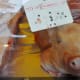 A pig with a label sticking through his eye.