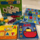 Alphabet puzzles, books, popbeads, alligators, and word activities
