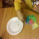 Glue on wiggly eye and draw on mouth. Then glue on aluminum foil to add sparkle.