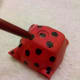 Paint black spots with the end of a paintbrush.