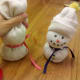 Tie ribbon around middle of filling part of sock for the scarf.