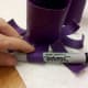 Curl the legs of the octopus upward by wrapping around a thick marker.